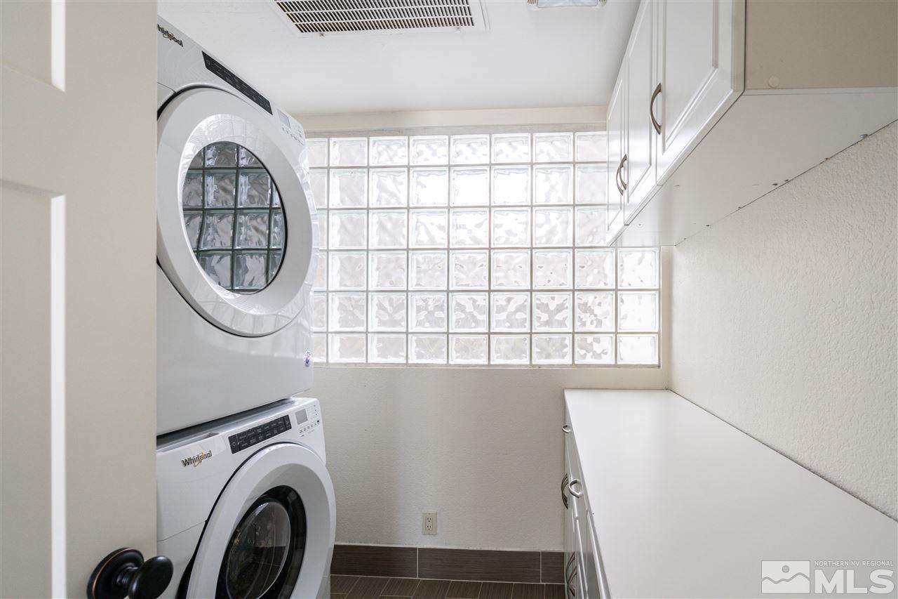 3975 Lamay Lane Reno, NV 89511 - Photo 12 of 28 a view of a hallway with washer and dryer