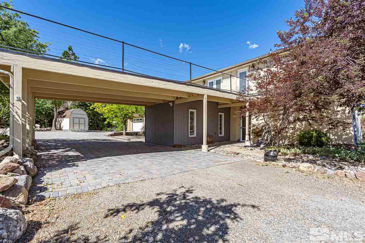 3975 Lamay Lane Reno, NV 89511 - Photo 3 of 28 a front view of a house with a yard and garage