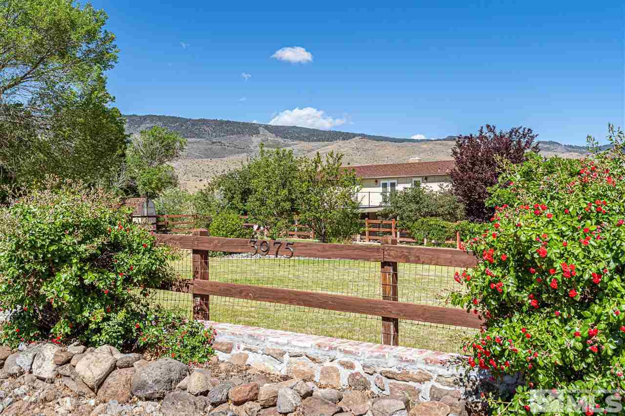3975 Lamay Lane Reno, NV 89511 - Photo 5 of 28 a view of a garden with a bench in a garden
