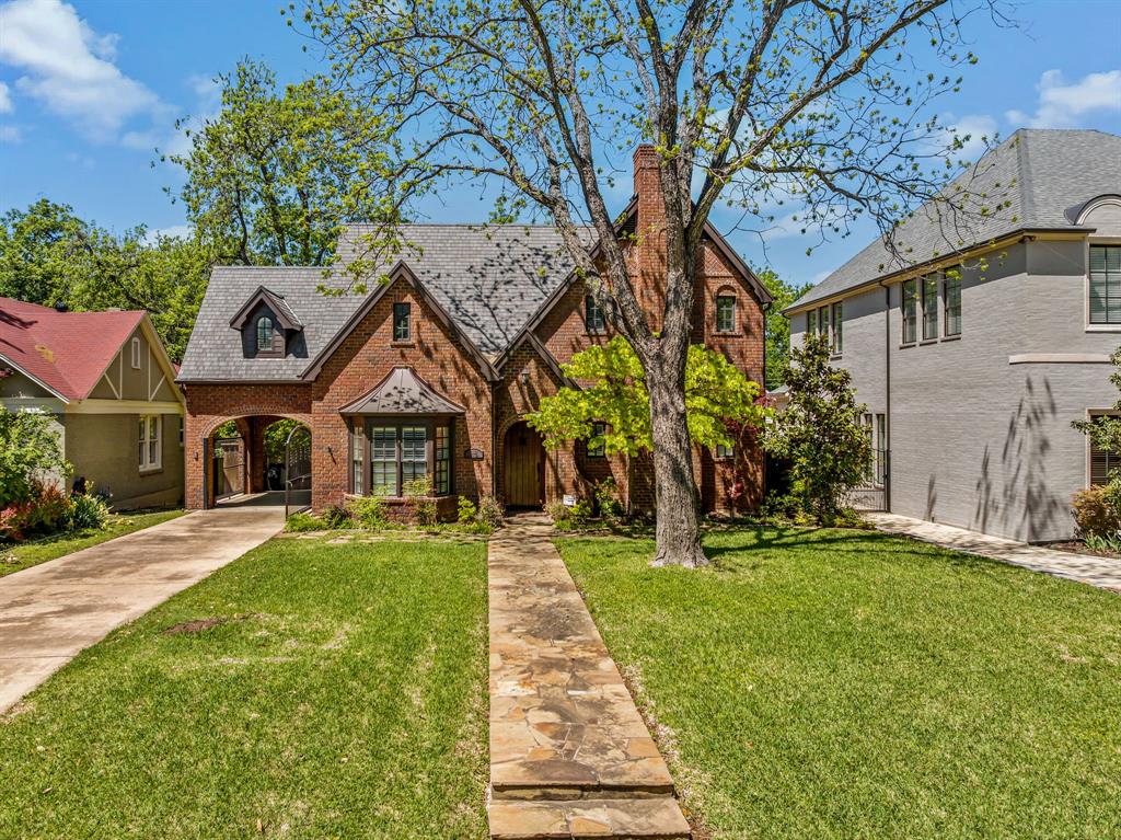 2552 Stadium Drive Fort Worth, TX 76109 - Photo 1 of 1 a front view of a house with a yard and trees