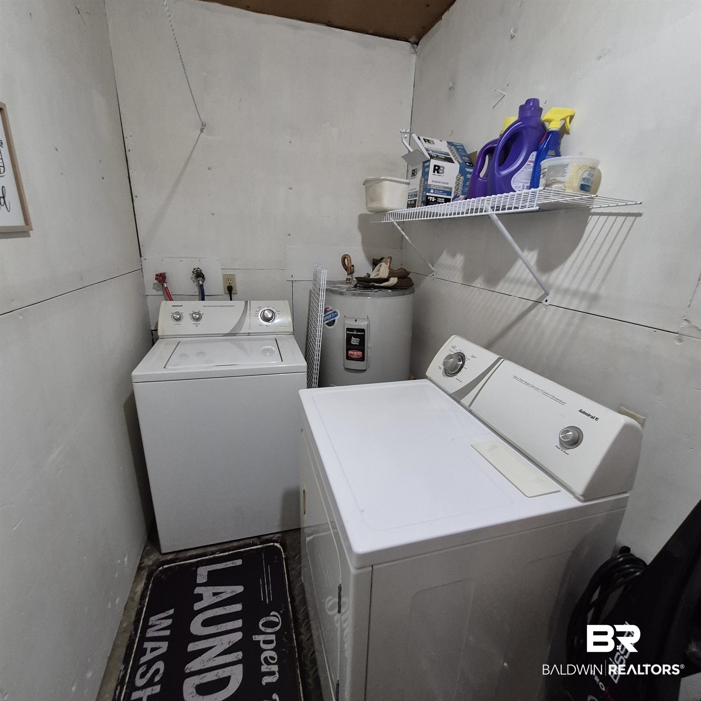 491 Forrest Avenue Castleberry, AL 36432 - Photo 21 of 33 Laundry area with washing machine and clothes dryer and water heater