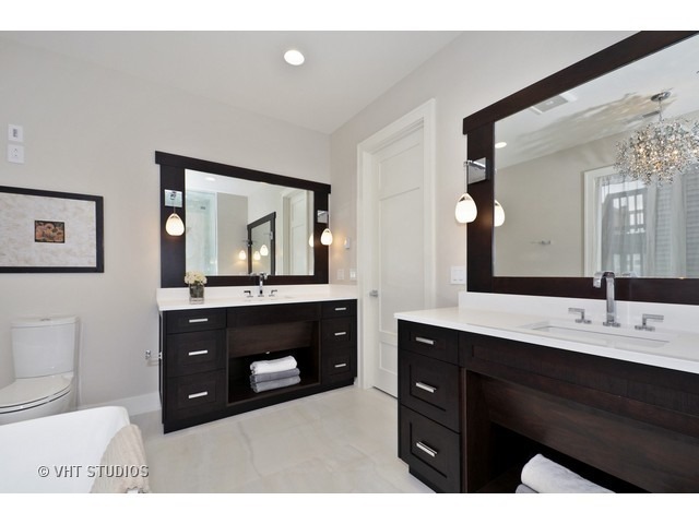 1324 West Melrose Street Chicago, IL 60657 - Photo 14 of 20 a bathroom with a sink vanity and a mirror