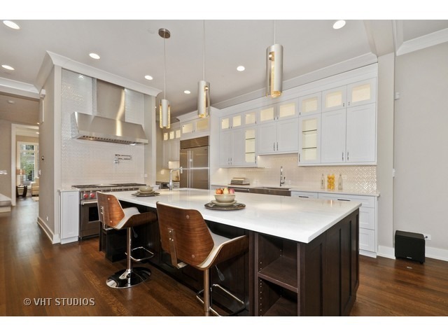 1324 West Melrose Street Chicago, IL 60657 - Photo 4 of 20 a kitchen with a sink cabinets and wooden floor