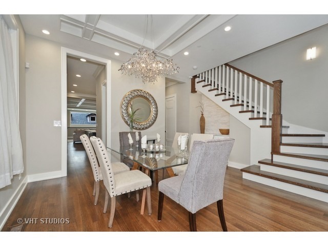 1324 West Melrose Street Chicago, IL 60657 - Photo 6 of 20 a view of a dining room with furniture a chandelier and wooden floor