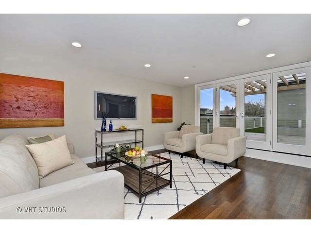 1324 West Melrose Street Chicago, IL 60657 - Photo 9 of 20 a living room with furniture and a flat screen tv