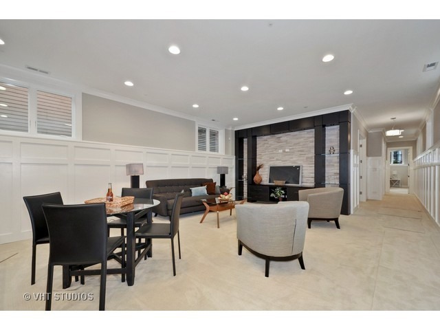 1324 West Melrose Street Chicago, IL 60657 - Photo 10 of 20 a living room with furniture a large window and a table