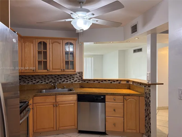 a bathroom with a sink a mirror and a shower