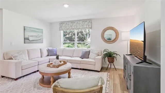 a living room with furniture and a window