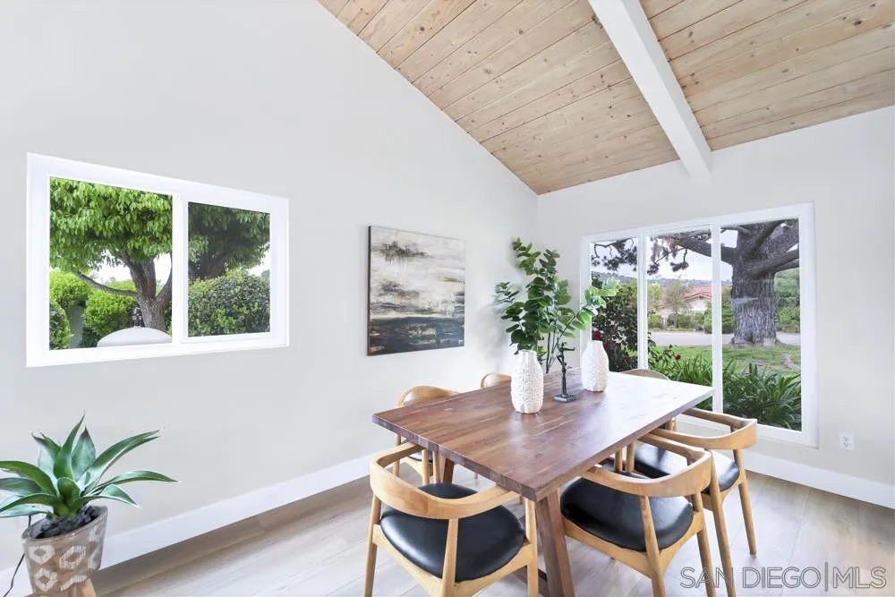 3563 Oak Cliff Drive Fallbrook, CA 92028 - Photo 11 of 43 a view of a dining room with furniture window and wooden floor