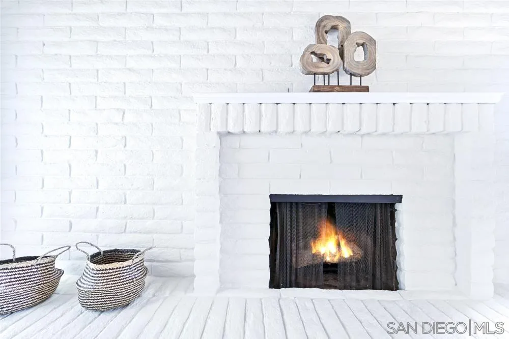 3563 Oak Cliff Drive Fallbrook, CA 92028 - Photo 12 of 43 a room with a fireplace and a couch