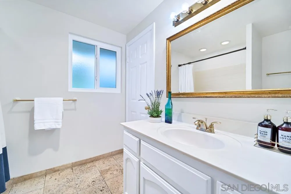 3563 Oak Cliff Drive Fallbrook, CA 92028 - Photo 20 of 43 a bathroom with a sink and a mirror