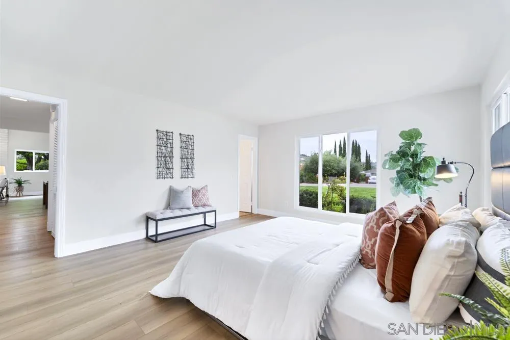 3563 Oak Cliff Drive Fallbrook, CA 92028 - Photo 22 of 43 a bedroom with a bed and a large window