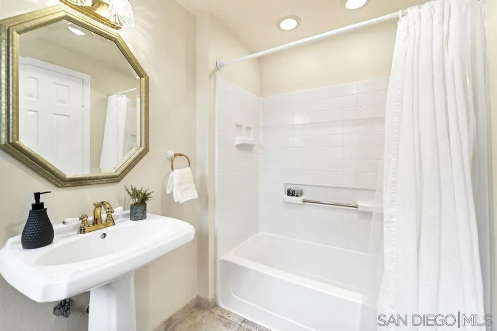 3563 Oak Cliff Drive Fallbrook, CA 92028 - Photo 25 of 43 a bathroom with a sink and a mirror