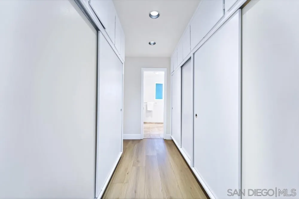 3563 Oak Cliff Drive Fallbrook, CA 92028 - Photo 26 of 43 a view of a hallway with wooden floor