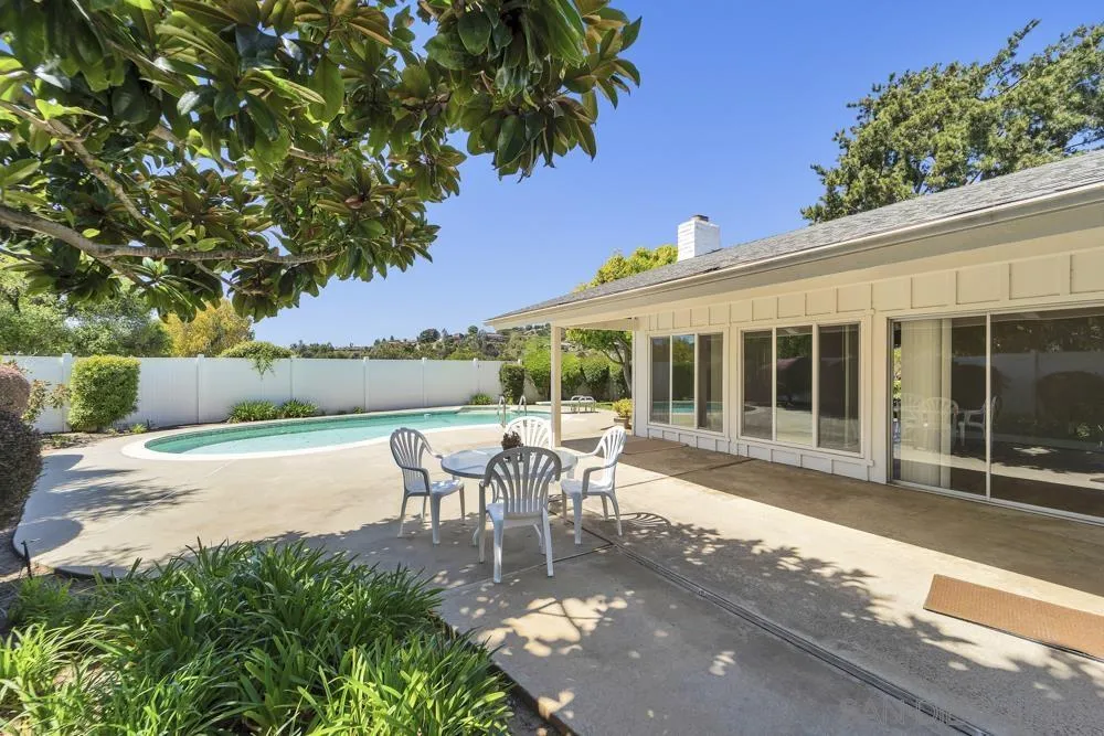 3563 Oak Cliff Drive Fallbrook, CA 92028 - Photo 28 of 43 a view of a patio with table and chairs and potted plants