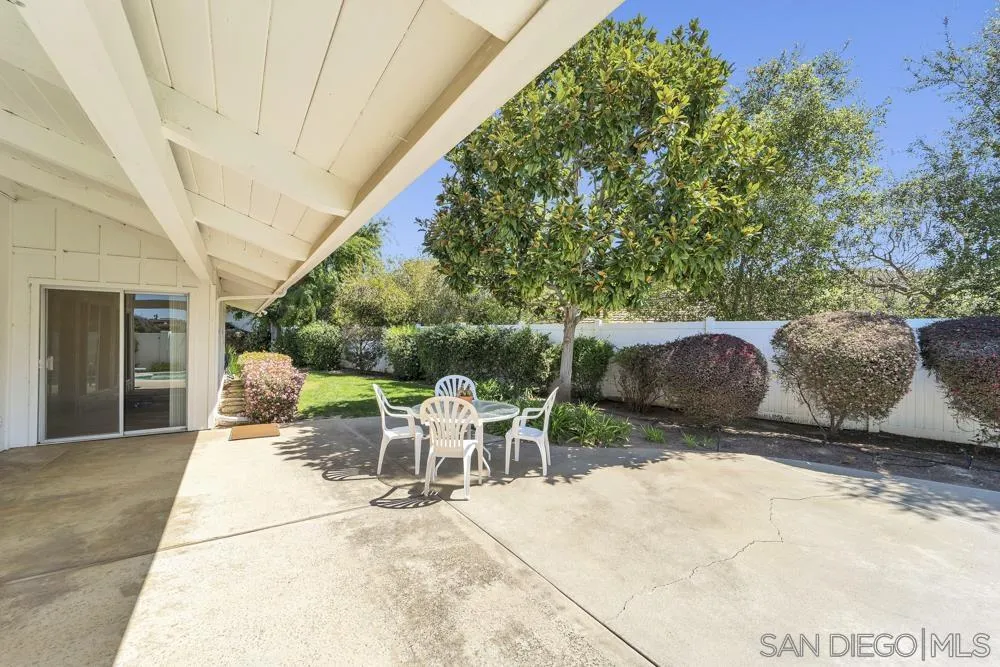 3563 Oak Cliff Drive Fallbrook, CA 92028 - Photo 30 of 43 a view of a patio with table and chairs and potted plants