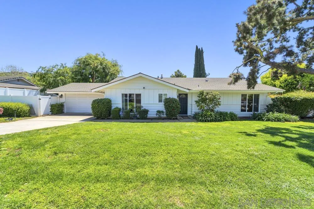 3563 Oak Cliff Drive Fallbrook, CA 92028 - Photo 34 of 43 a front view of a house with a garden and yard