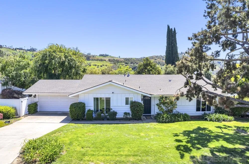 3563 Oak Cliff Drive Fallbrook, CA 92028 - Photo 36 of 43 a aerial view of a house with a yard and palm trees