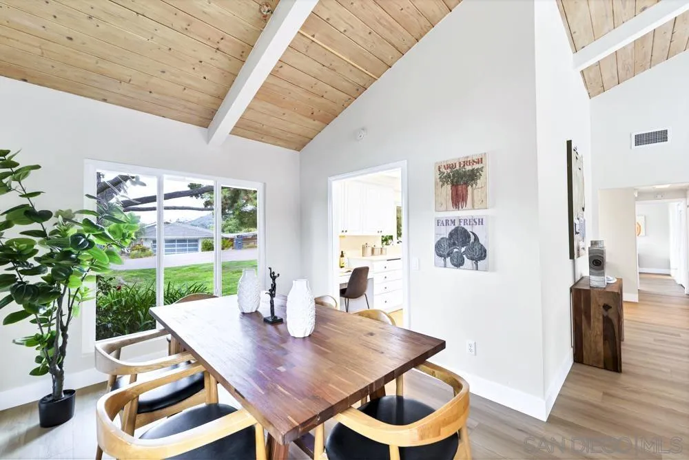 3563 Oak Cliff Drive Fallbrook, CA 92028 - Photo 10 of 43 a view of a dining room with furniture and wooden floor