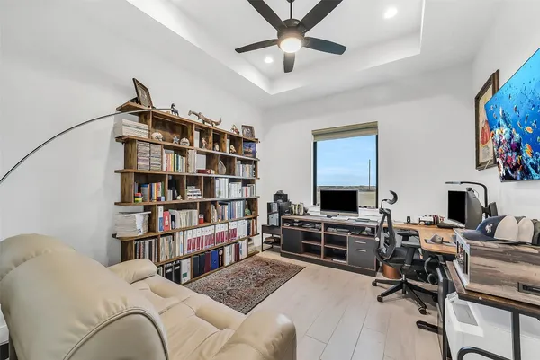 a view of a house with backyard sitting area and garden