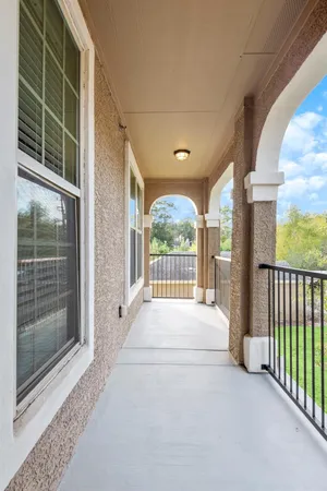 a view of an empty room with a balcony