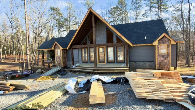 a view of a house with pool and sitting area