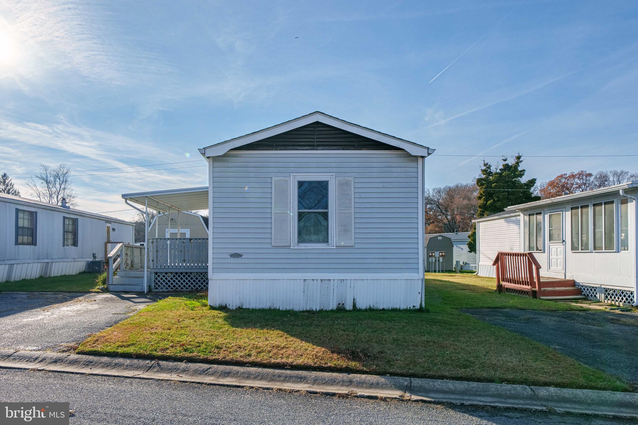 57 Gypsum Drive, Unit 195 Newark, DE 19713 - Photo 17 of 19 a view of backyard of house with wooden fence