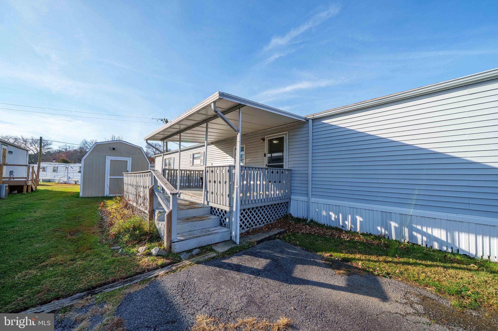 57 Gypsum Drive, Unit 195 Newark, DE 19713 - Photo 2 of 19 a front view of a house with a yard