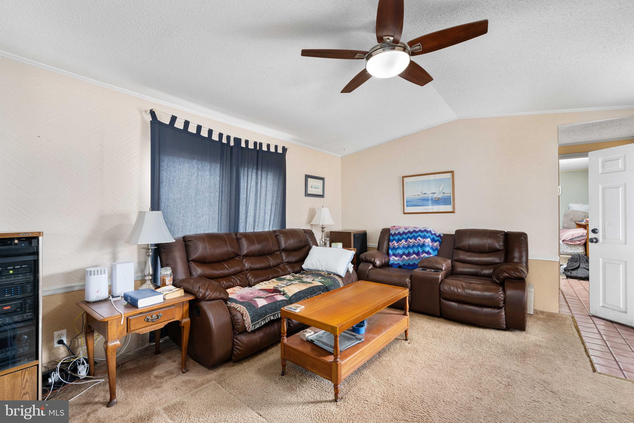 57 Gypsum Drive, Unit 195 Newark, DE 19713 - Photo 5 of 19 a living room with furniture a ceiling fan and a rug