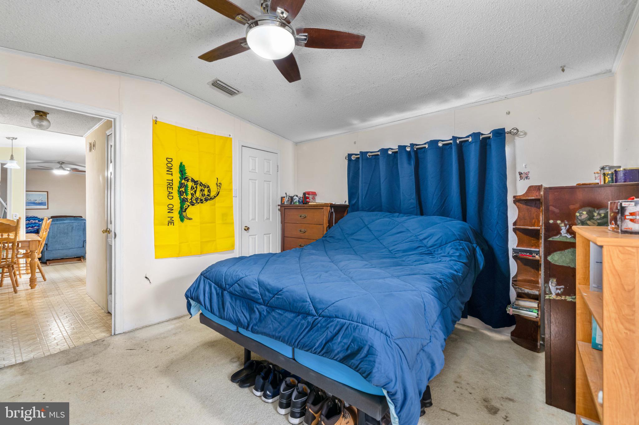 57 Gypsum Drive, Unit 195 Newark, DE 19713 - Photo 10 of 19 a spacious bedroom with a bed and a chandelier