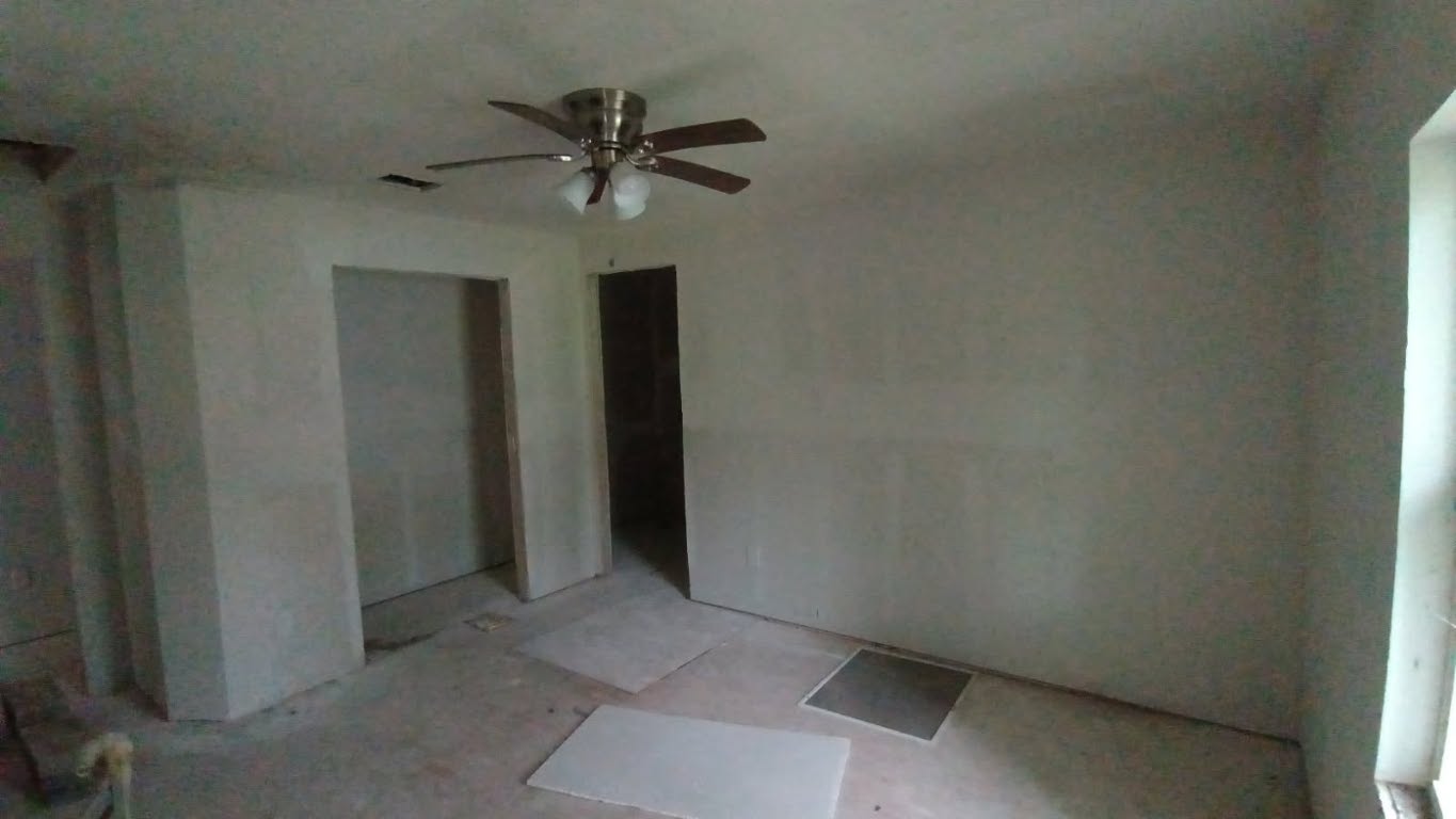 112 Ila Street Elgin, TX 78621 - Photo 6 of 27 Unfinished bedroom with ceiling fan and ensuite