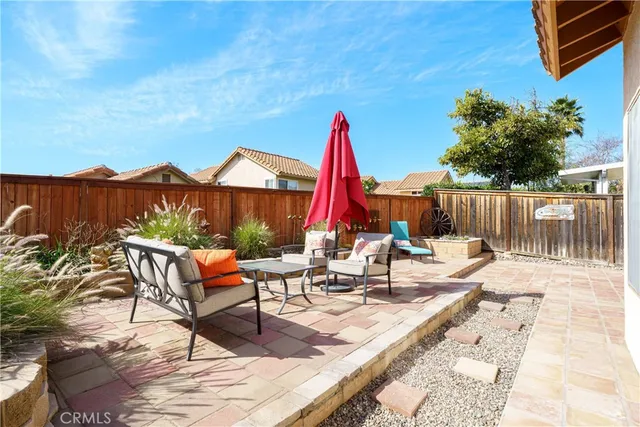 a building outdoor space with patio furniture and potted plants