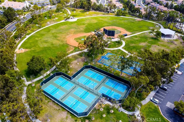 a view of a swimming pool with a yard and outdoor seating