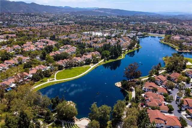 an aerial view of a house with swimming pool and outdoor space