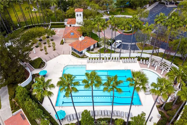an aerial view of residential houses with city view