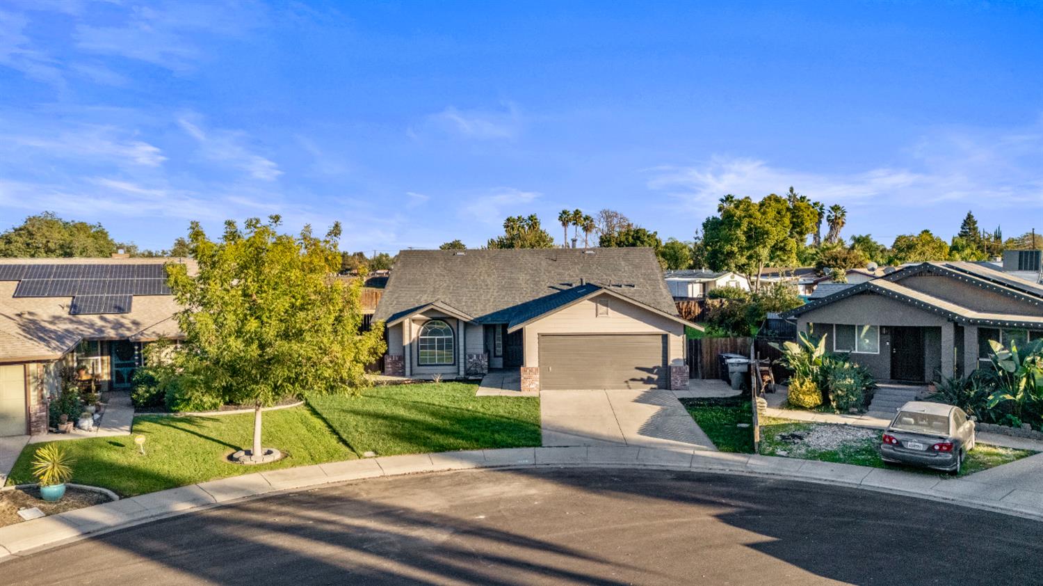 1128 Raymond Drive Modesto, CA 95351 - Photo 2 of 32 a view of street with cars