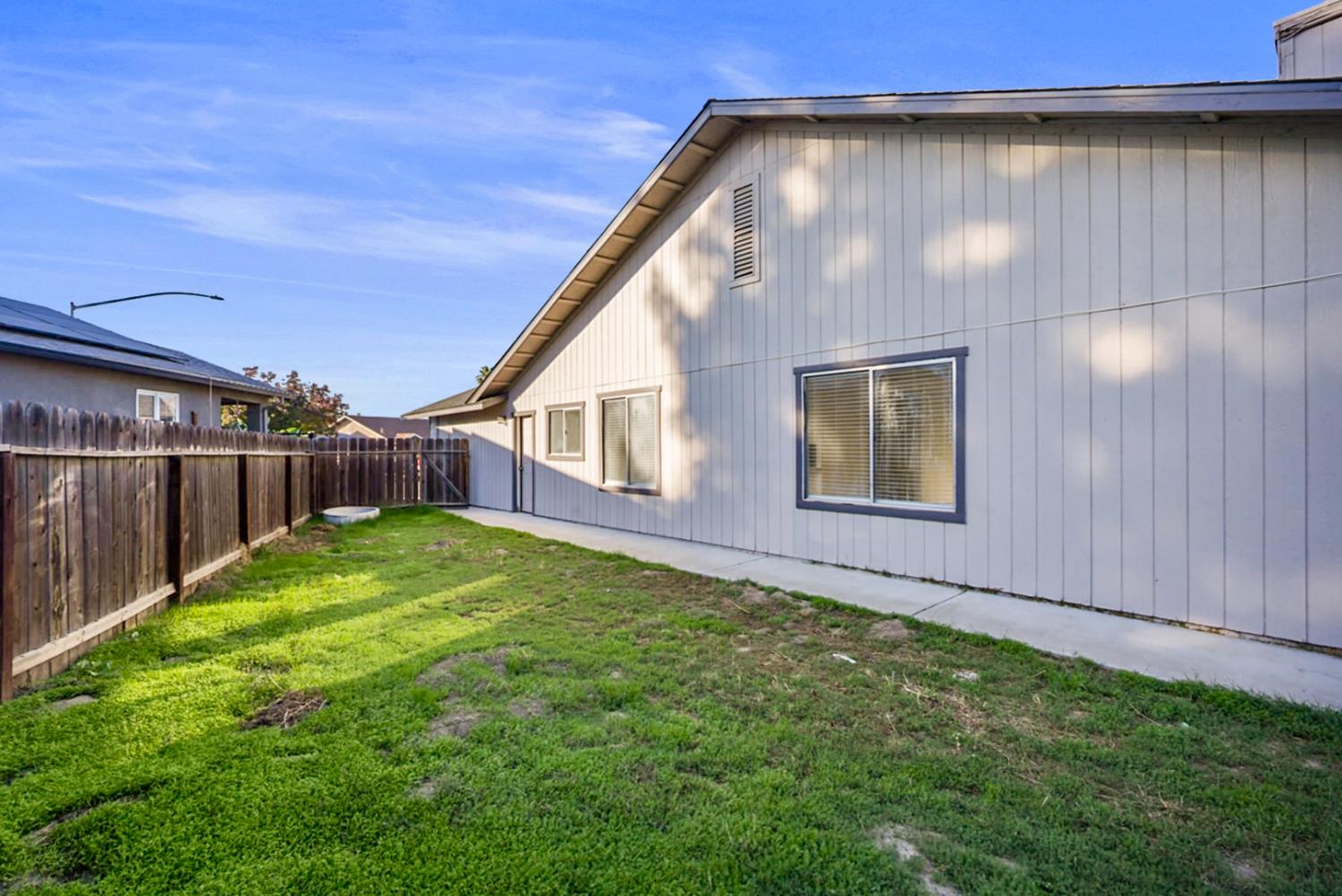 1128 Raymond Drive Modesto, CA 95351 - Photo 26 of 32 a view of backyard with deck and garden