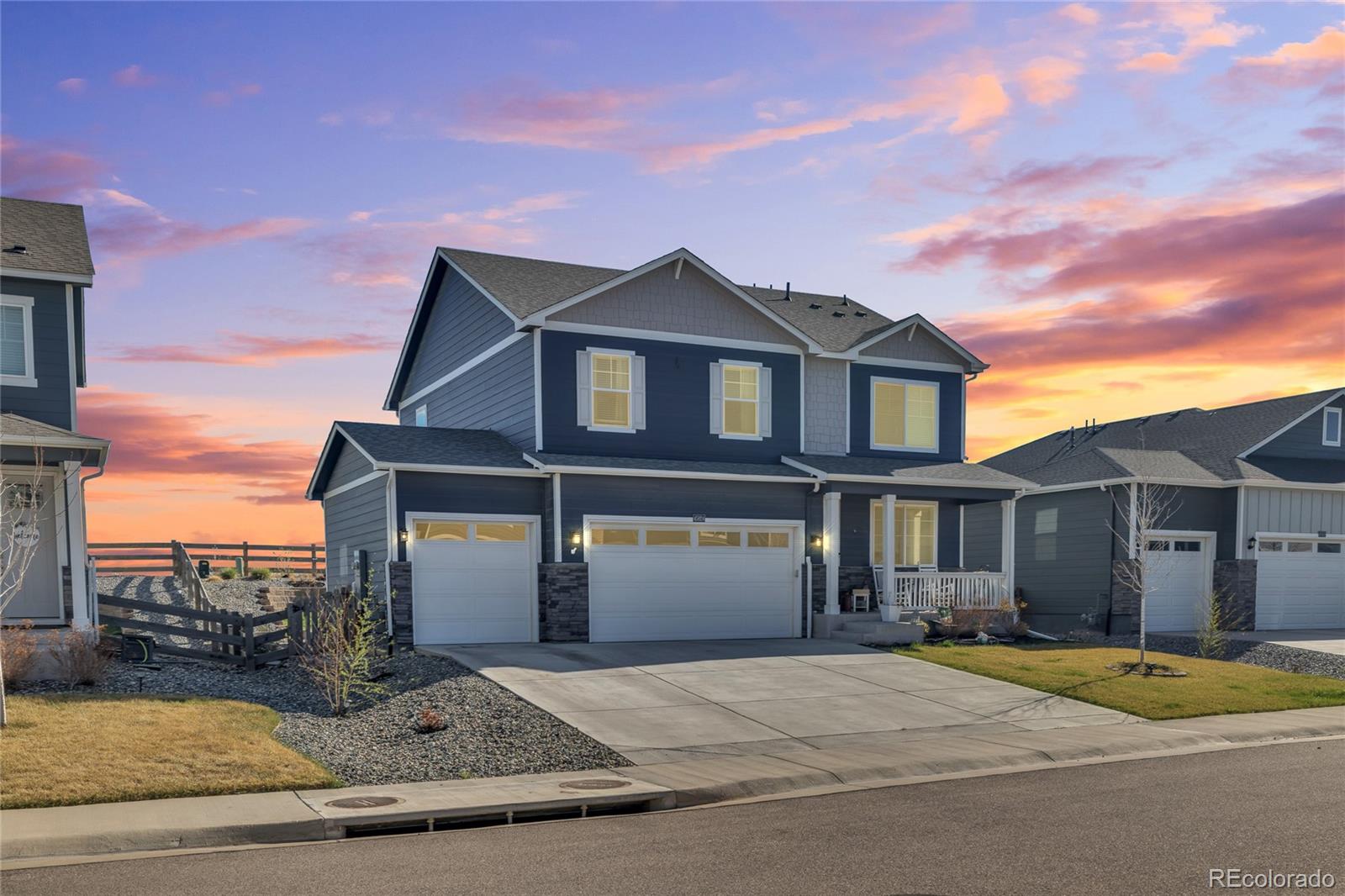 45824 Silverdrop Avenue Bennett, CO 80102 - Photo 2 of 49 a front view of a house with a yard