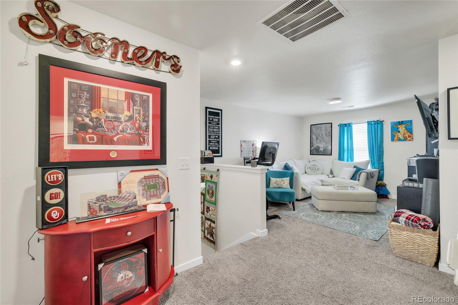 45824 Silverdrop Avenue Bennett, CO 80102 - Photo 23 of 49 a living room with furniture and a fireplace