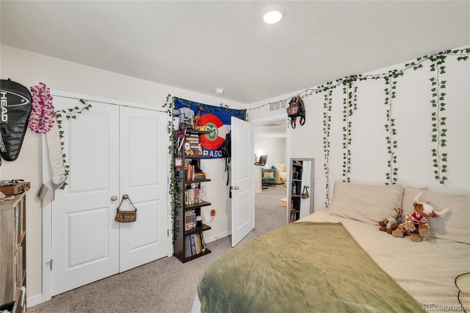45824 Silverdrop Avenue Bennett, CO 80102 - Photo 35 of 49 a bed room with a bed and a couch