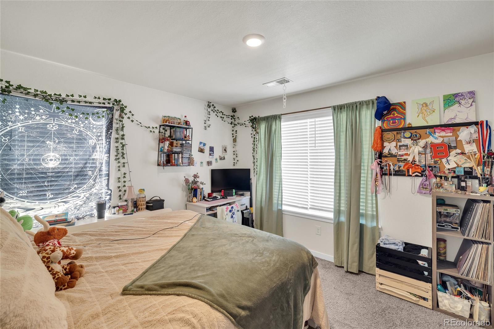 45824 Silverdrop Avenue Bennett, CO 80102 - Photo 36 of 49 a bedroom with a bed and a desk