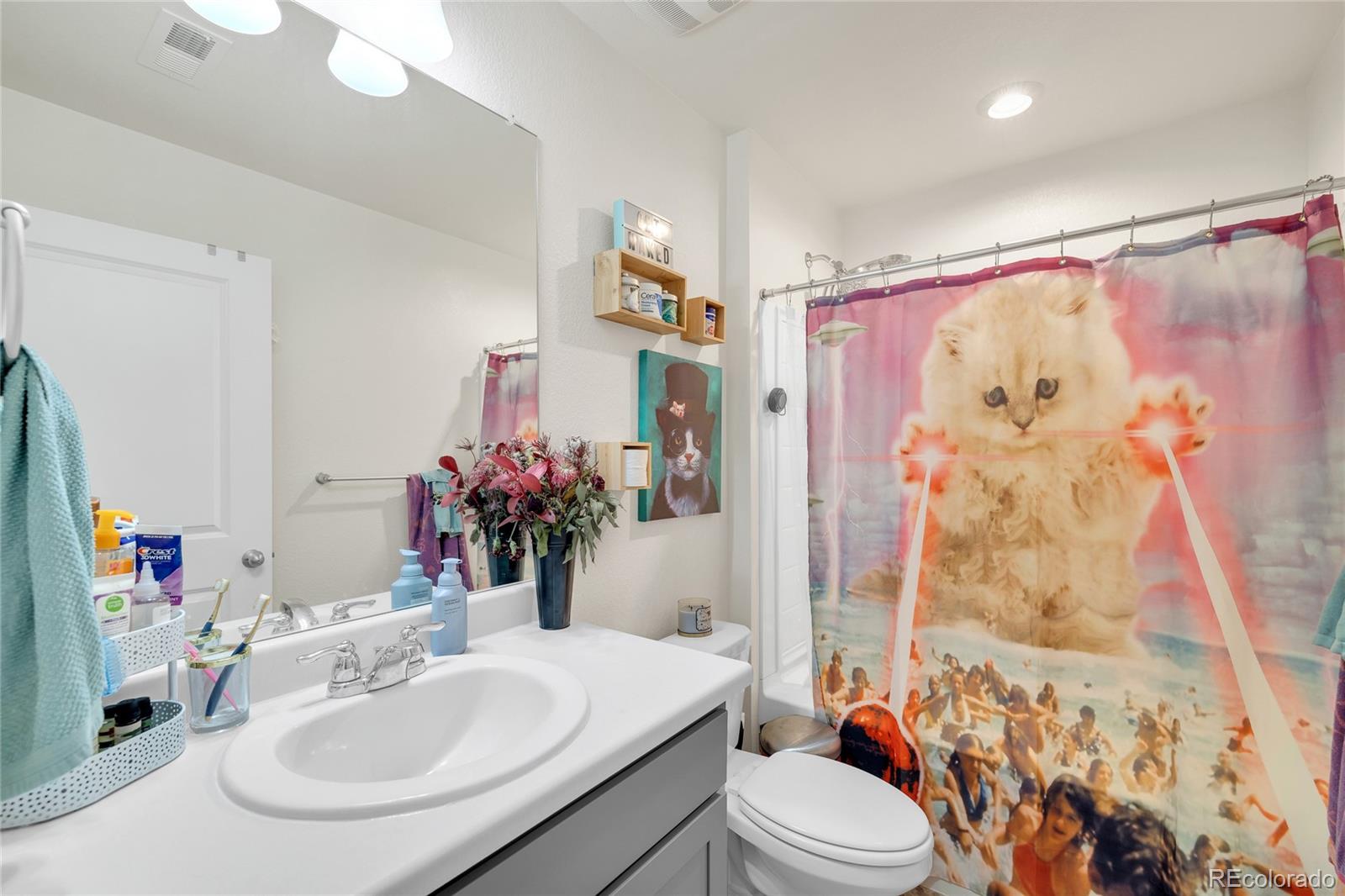 45824 Silverdrop Avenue Bennett, CO 80102 - Photo 39 of 49 a bathroom with a sink toilet tub and shower