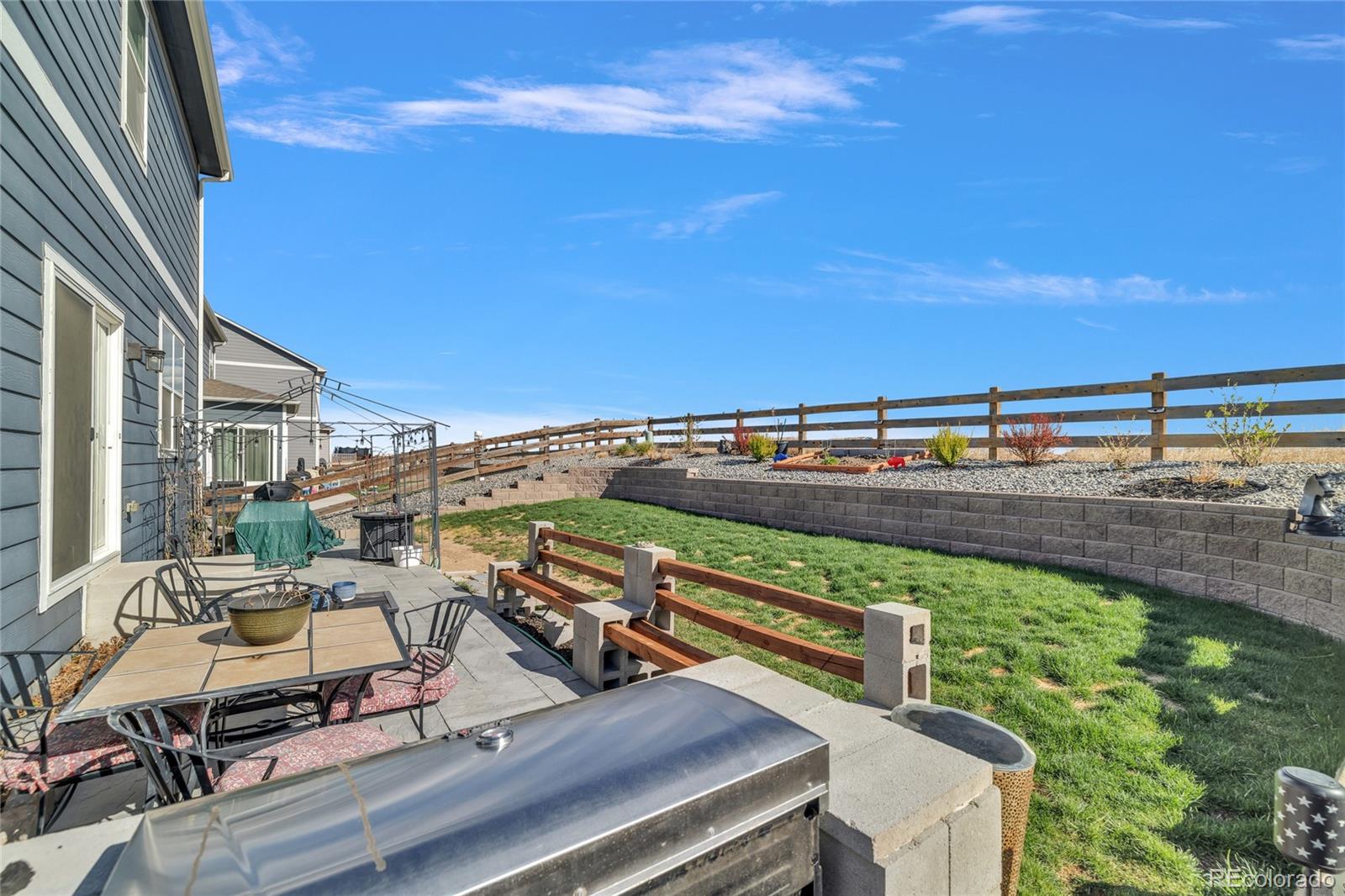 45824 Silverdrop Avenue Bennett, CO 80102 - Photo 44 of 49 a view of a balcony with chairs