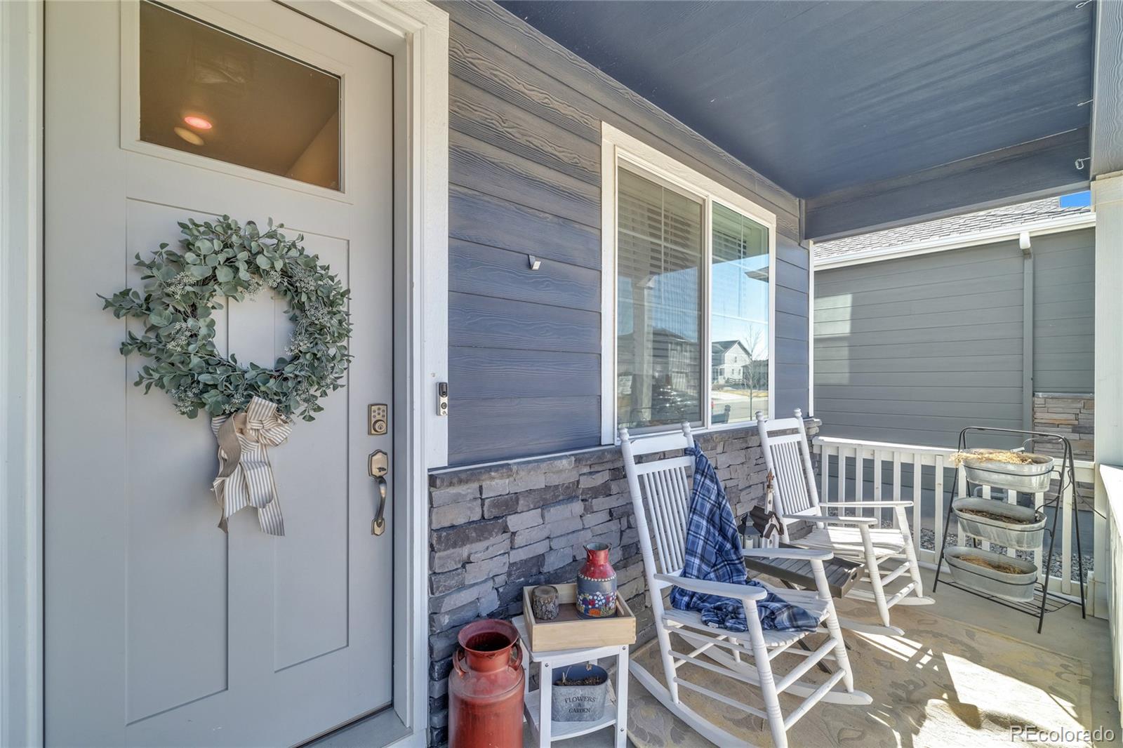 45824 Silverdrop Avenue Bennett, CO 80102 - Photo 5 of 49 a view of a patio with table and chairs and potted plants
