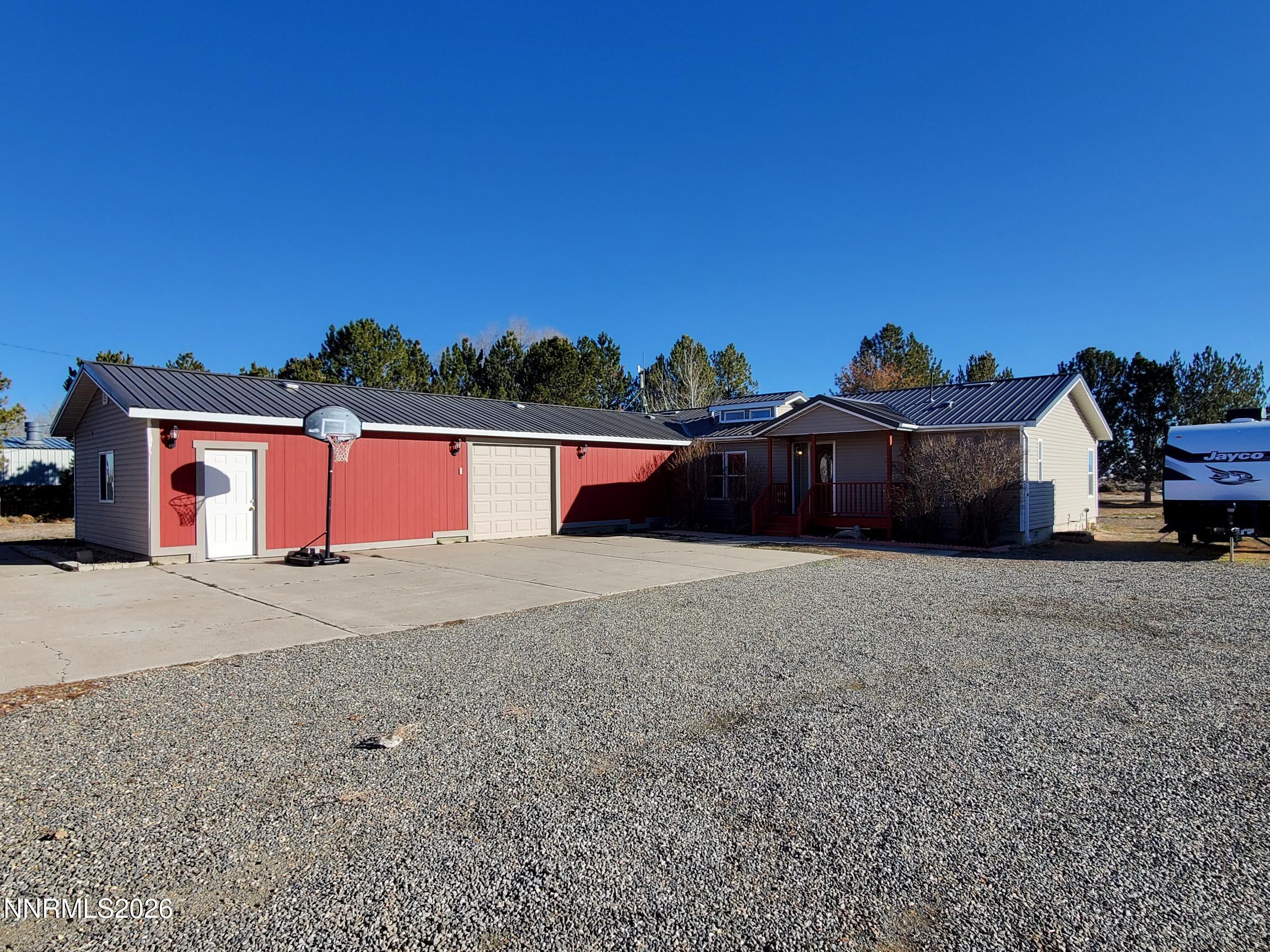 a front view of a house with a yard and street