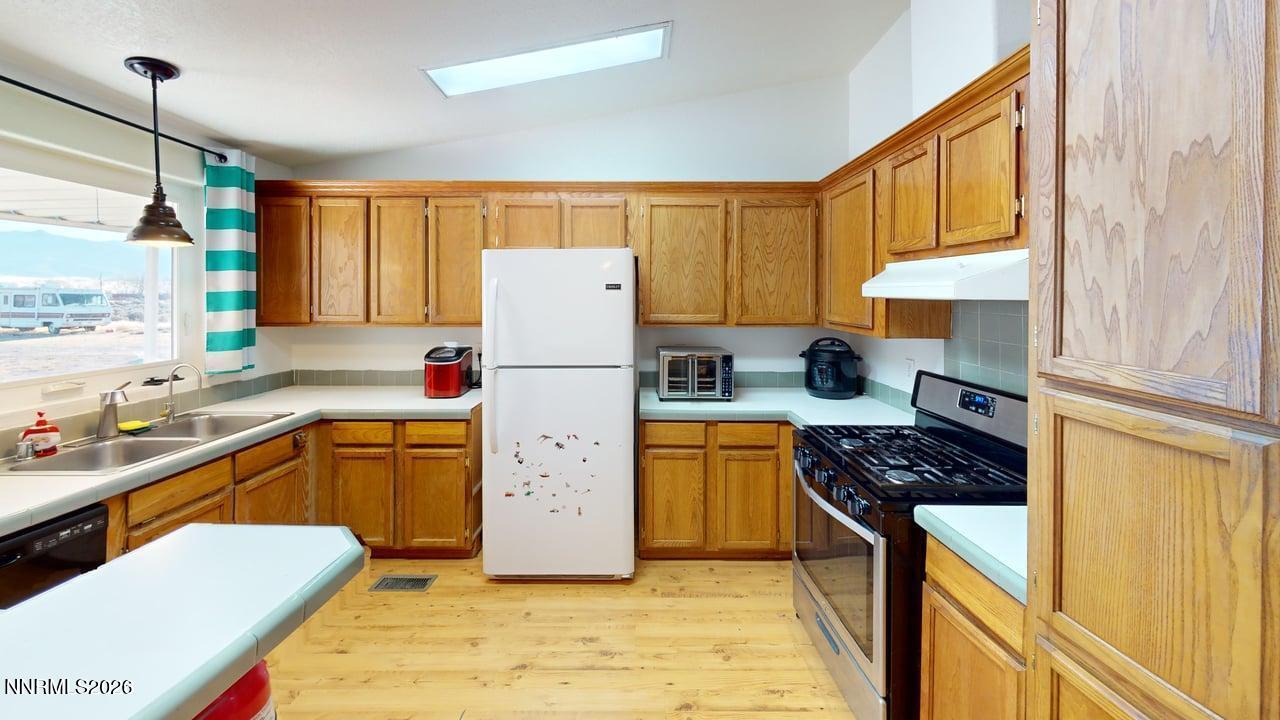 7430 West Rose Creek Road Winnemucca, NV 89445 - Photo 7 of 24 7430-W-Rose-Creek-Rd-Kitchen 1