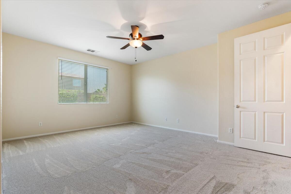 82732 Castleton Drive Indio, CA 92203 - Photo 14 of 45 an empty room with windows and fan