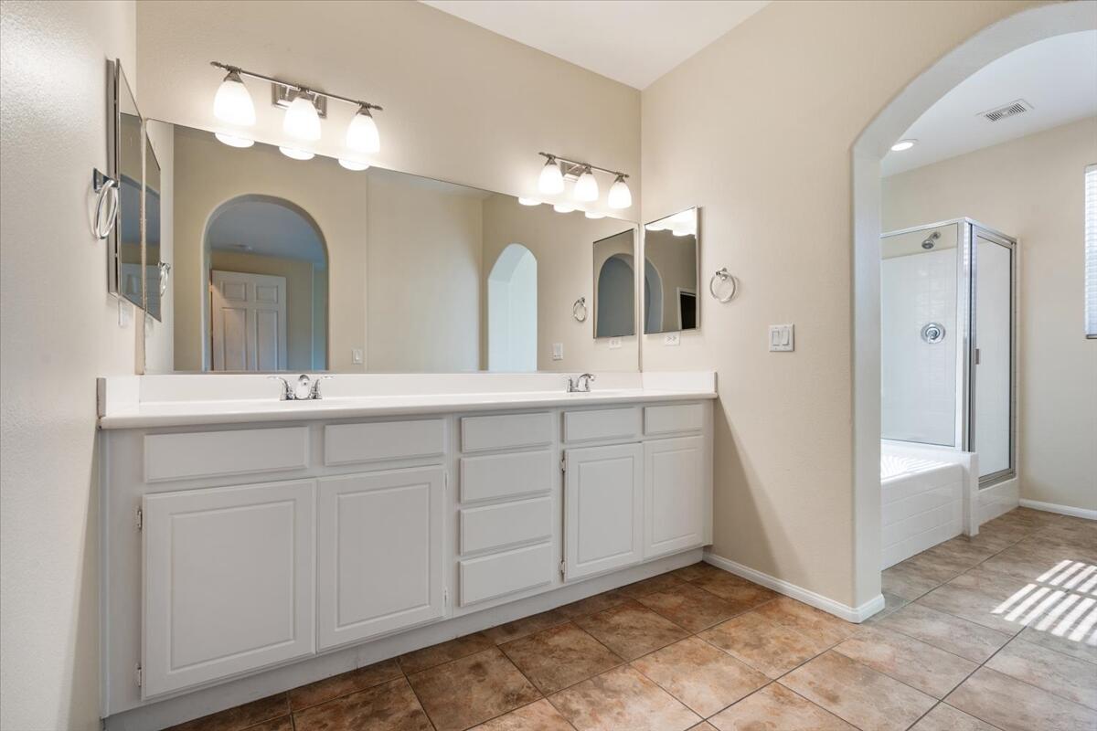 82732 Castleton Drive Indio, CA 92203 - Photo 15 of 45 a bathroom with a double vanity sink and a mirror