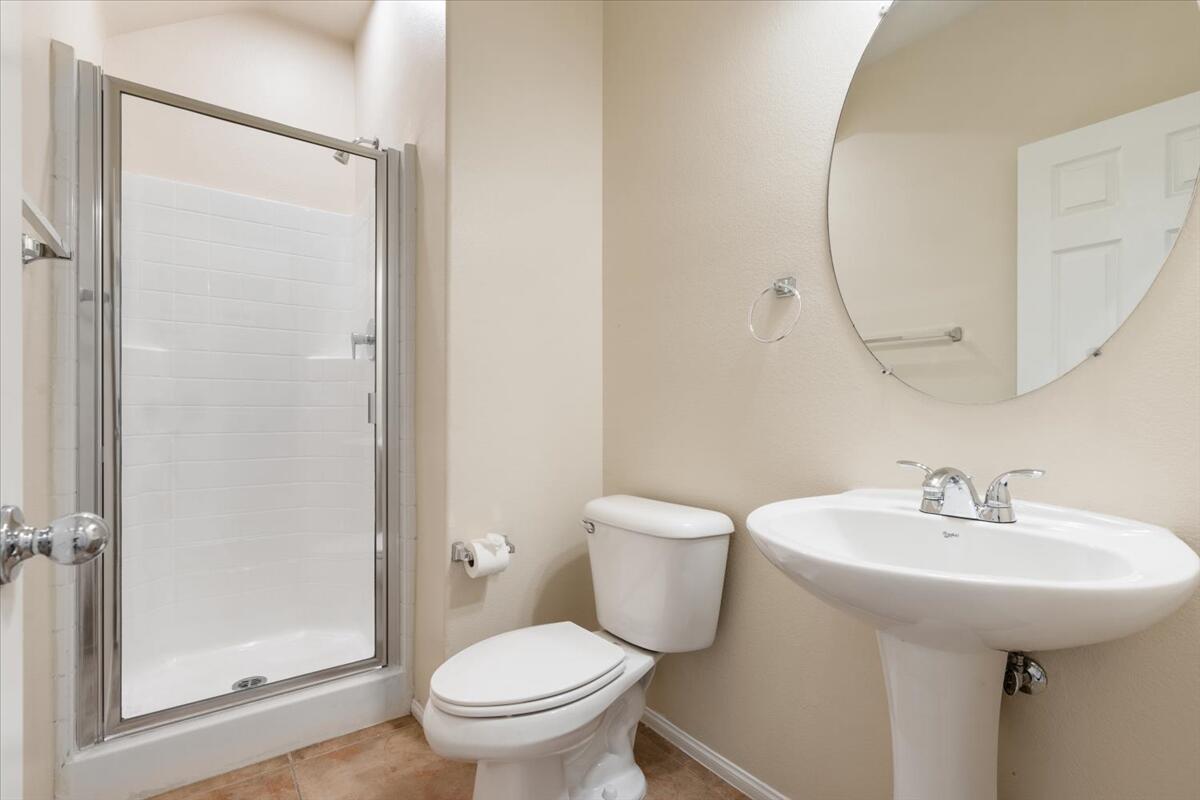 82732 Castleton Drive Indio, CA 92203 - Photo 18 of 45 a bathroom with a sink toilet and a mirror
