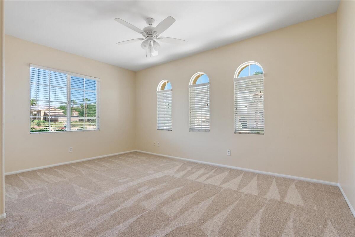 82732 Castleton Drive Indio, CA 92203 - Photo 20 of 45 an empty room with windows and fan